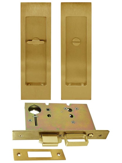 Premium Pocket-Door Mortise Lock Set with Rectangular Pulls in Aged Brass.